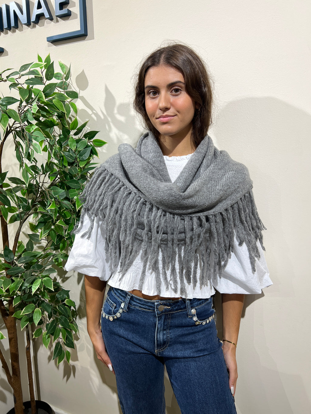 Capa flecos gris