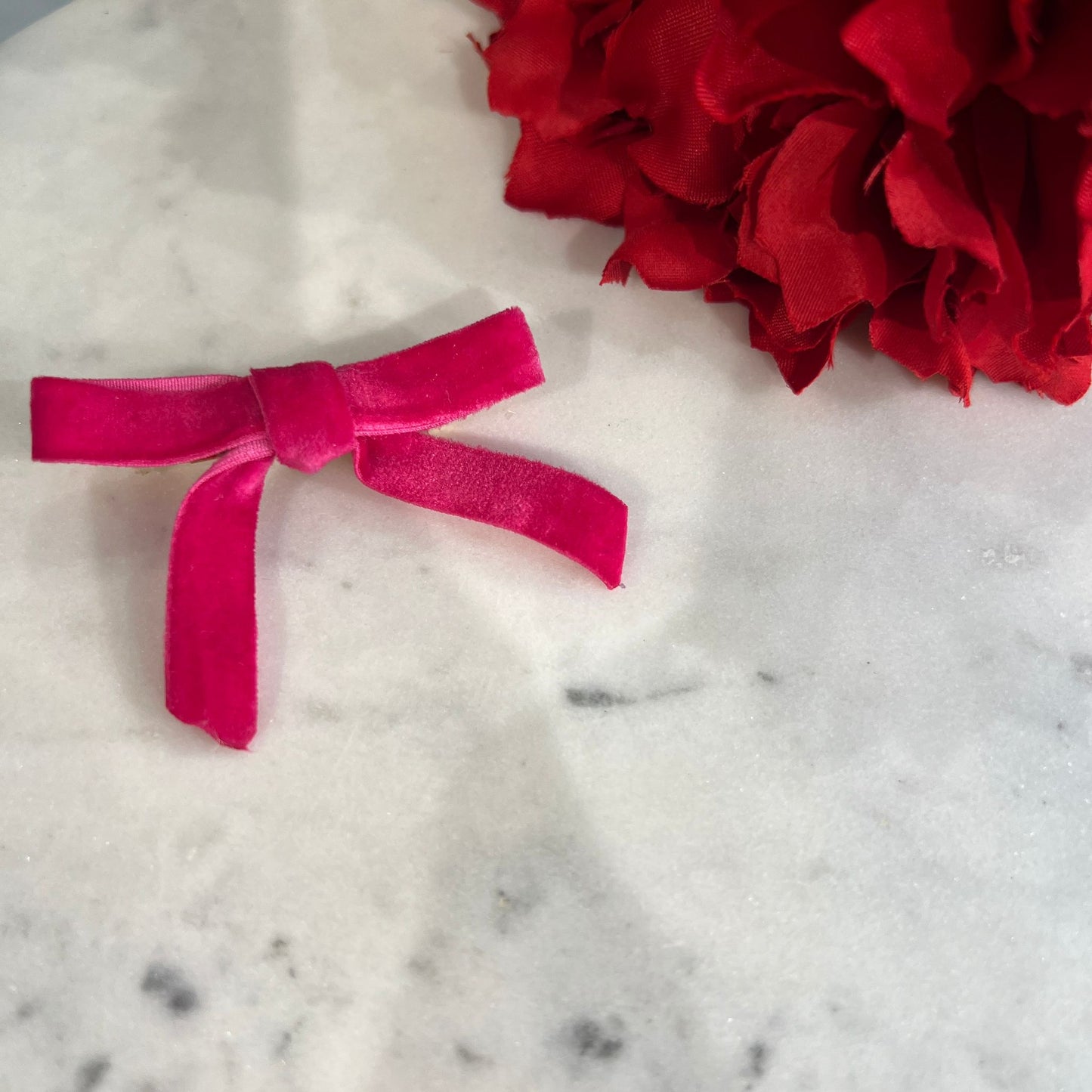 Broche lazo fucsia