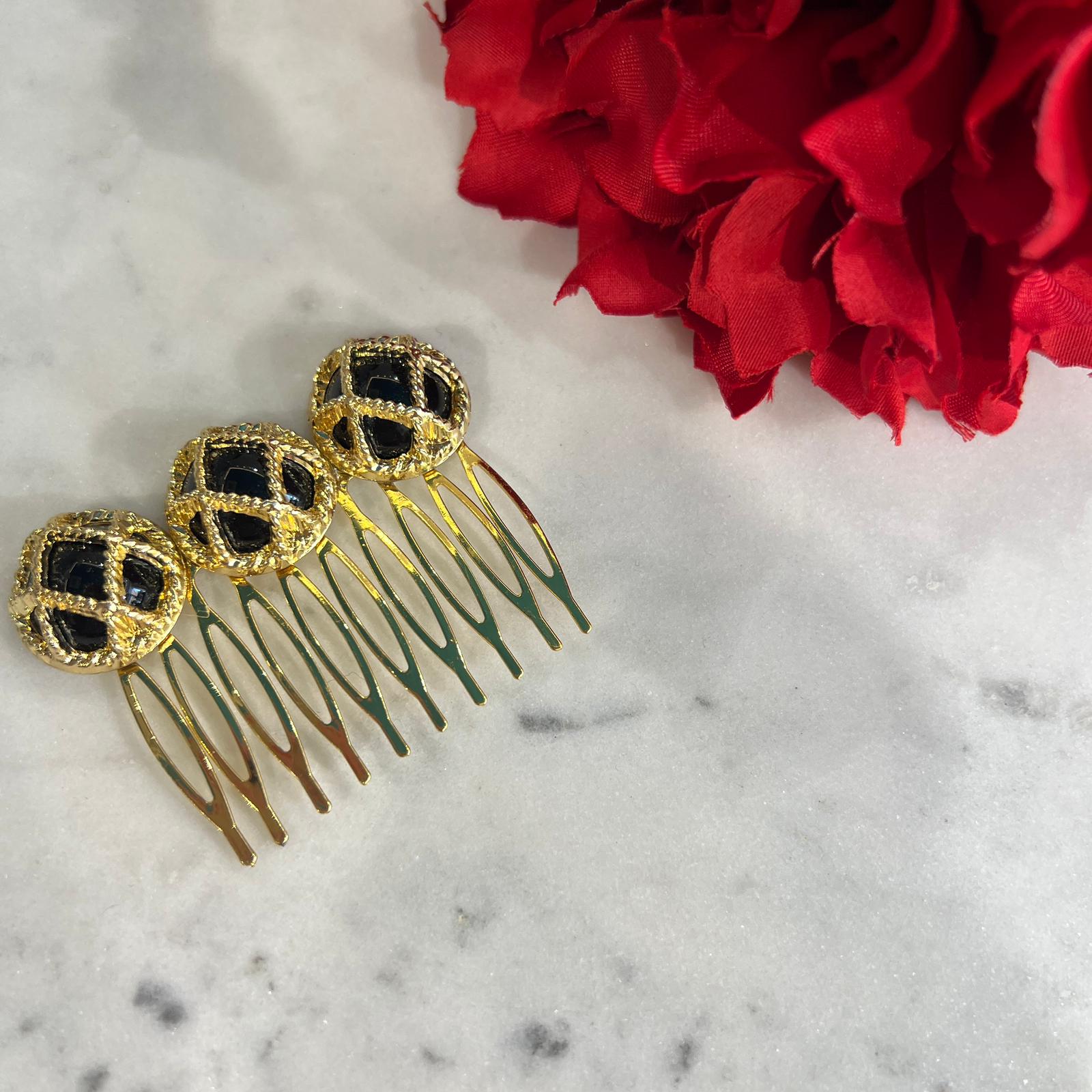 Peinecillo dorado y negro